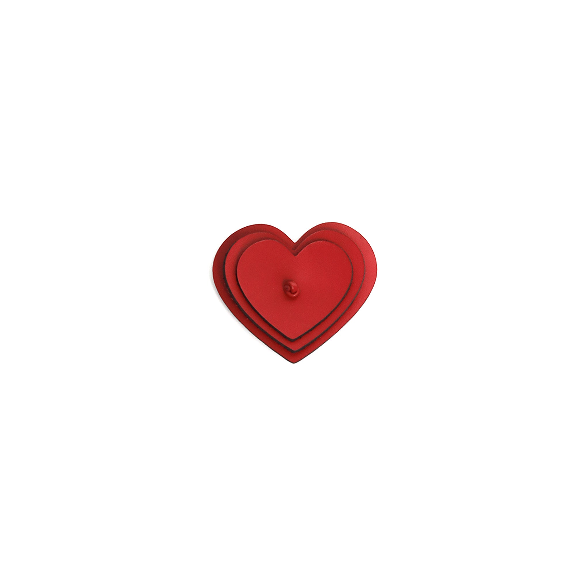 Red heart-shaped object on a white background